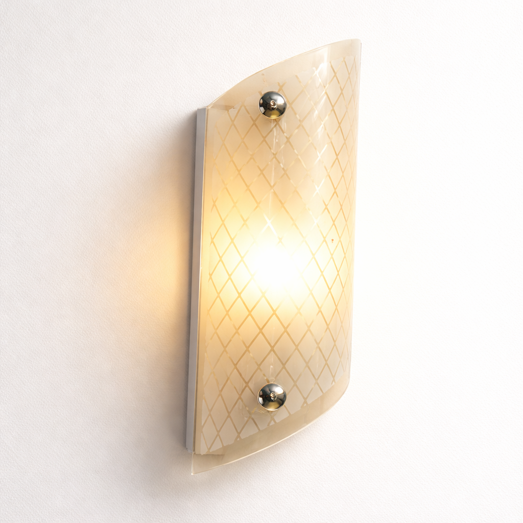 Wall-mounted light fixture with textured glass shade on a white background