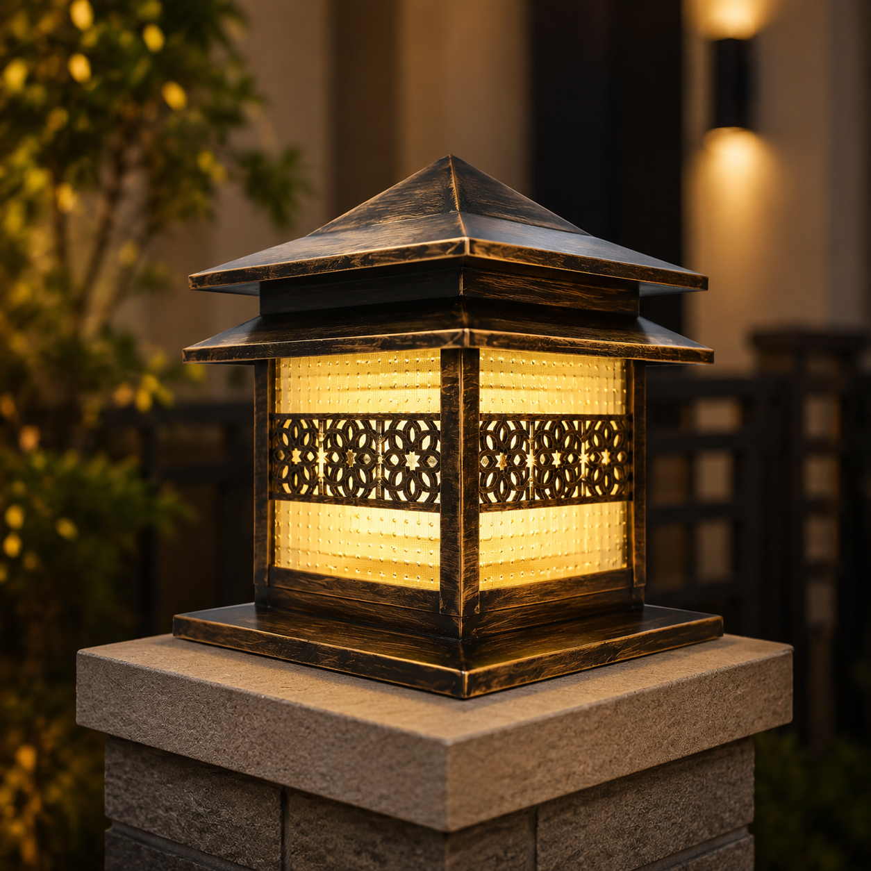 Decorative outdoor light fixture on a stone post with warm glow