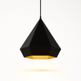 Black geometric pendant light with a gold interior on a white background