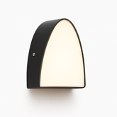 Black wall-mounted light fixture on a white background