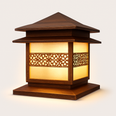 Outdoor pillar light with geometric cutout panel and warm frosted glow