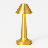 Gold table lamp on a white background