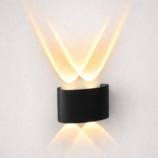 Modern black wall light fixture on a white wall
