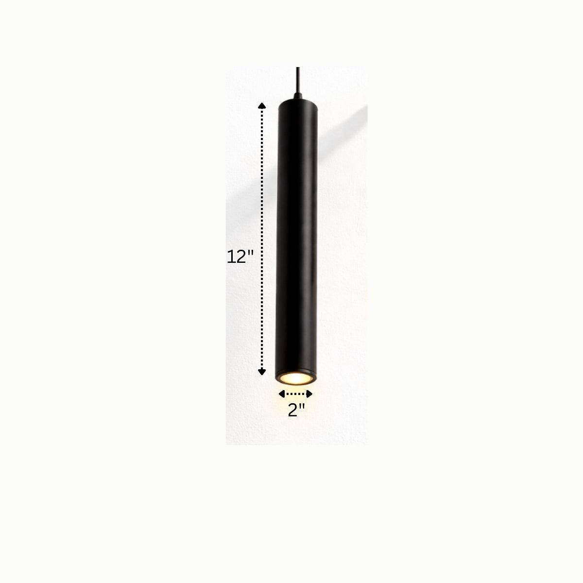 Black cylindrical pendant light with warm LED glow for modern homes