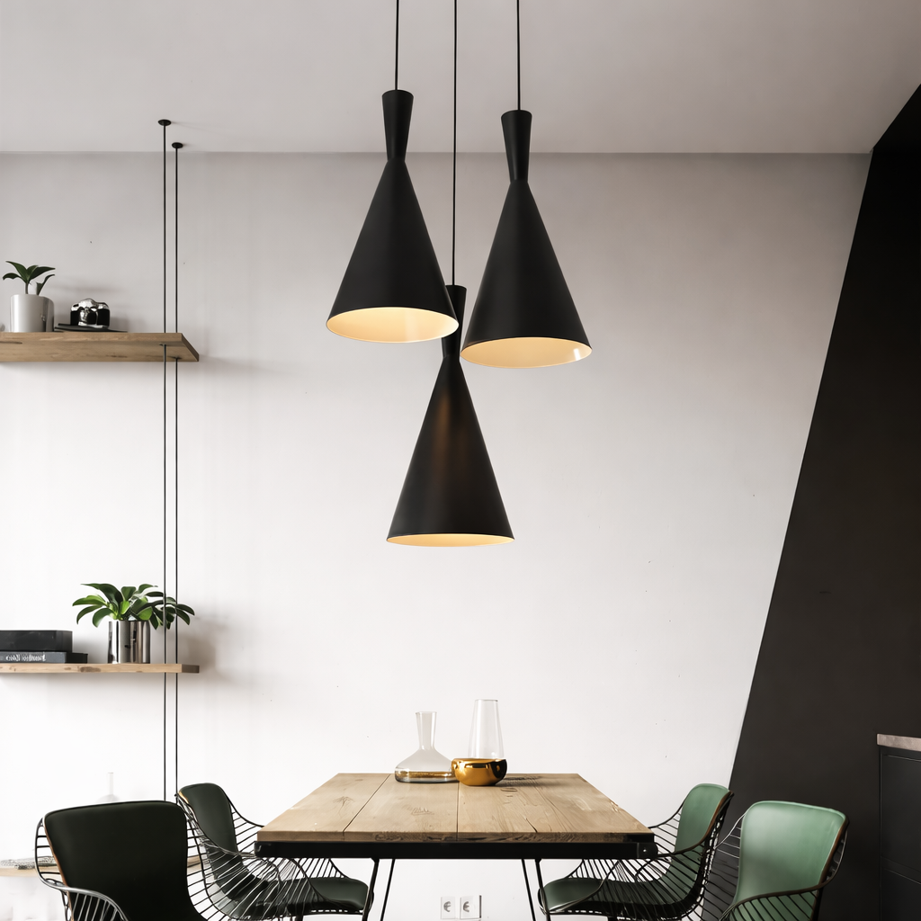 Modern dining area with black cone-shaped pendant lights, wooden table, and chairs.