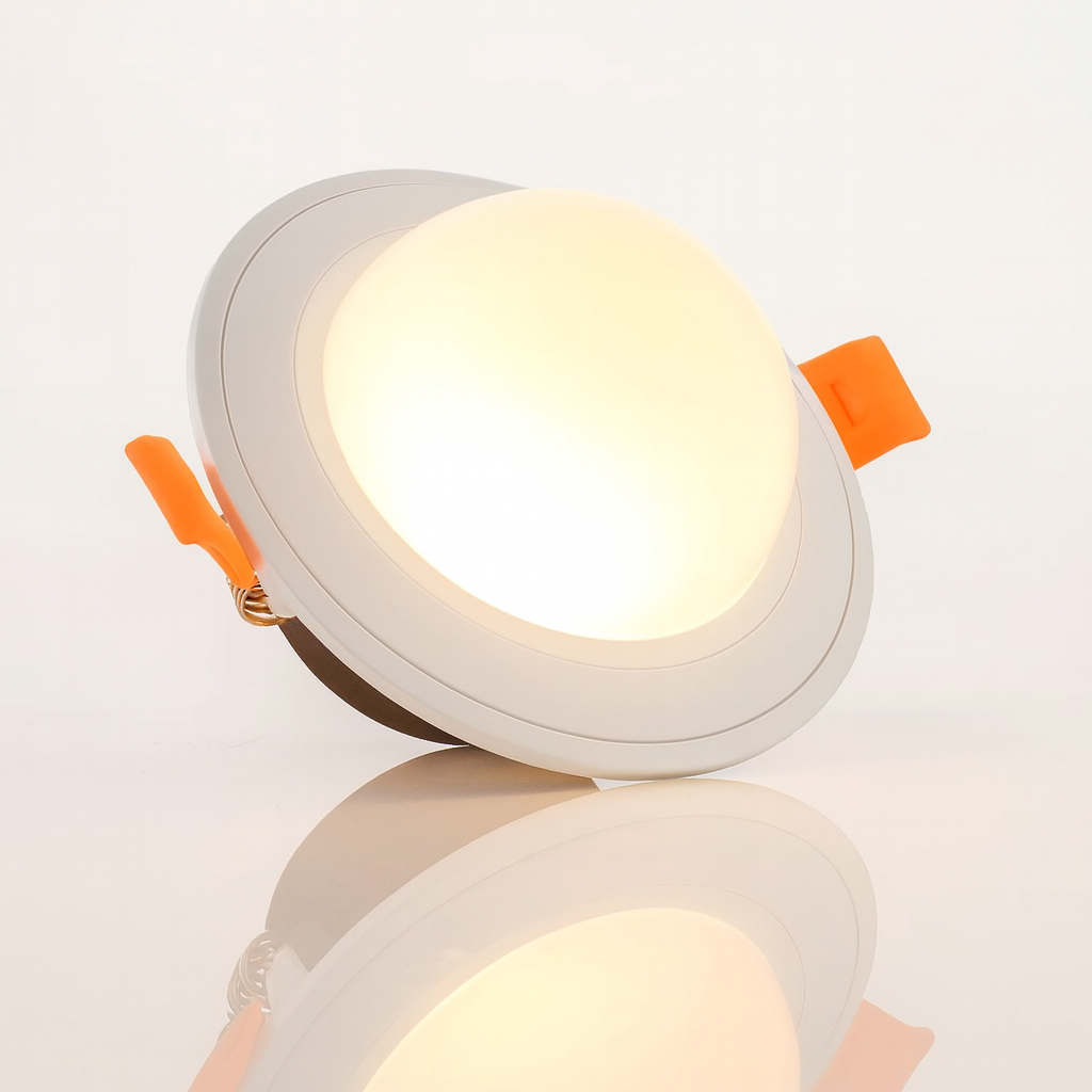 Round recessed ceiling light with orange accents on a white background