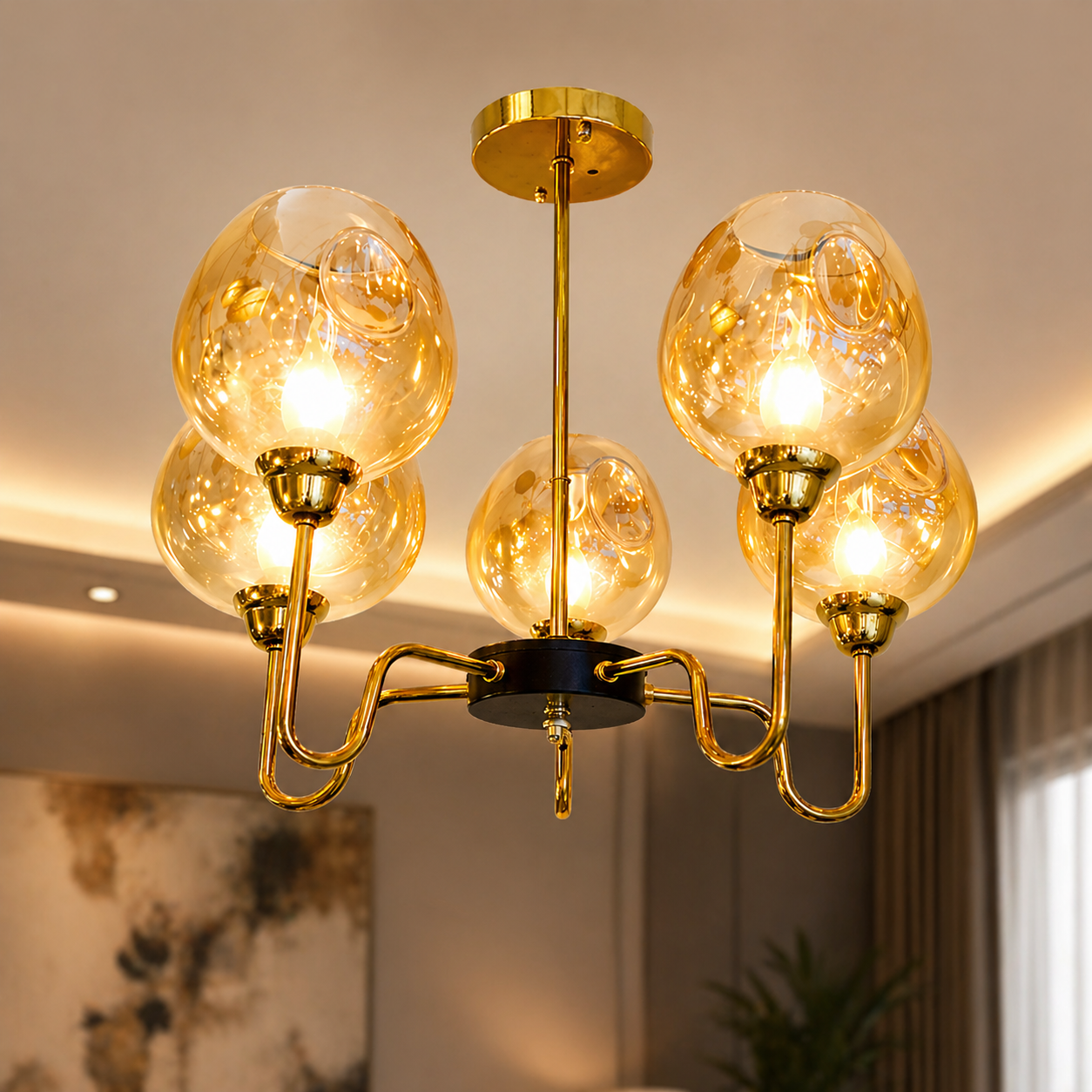 Modern chandelier with gold fixtures and glass bulbs in a room setting.