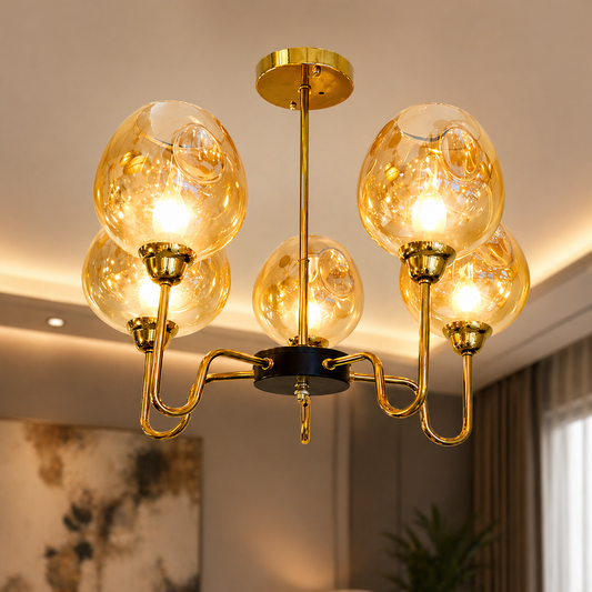 Modern chandelier with gold fixtures and glass bulbs in a room setting.