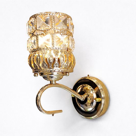 Gold wall sconce with crystal design on a white background