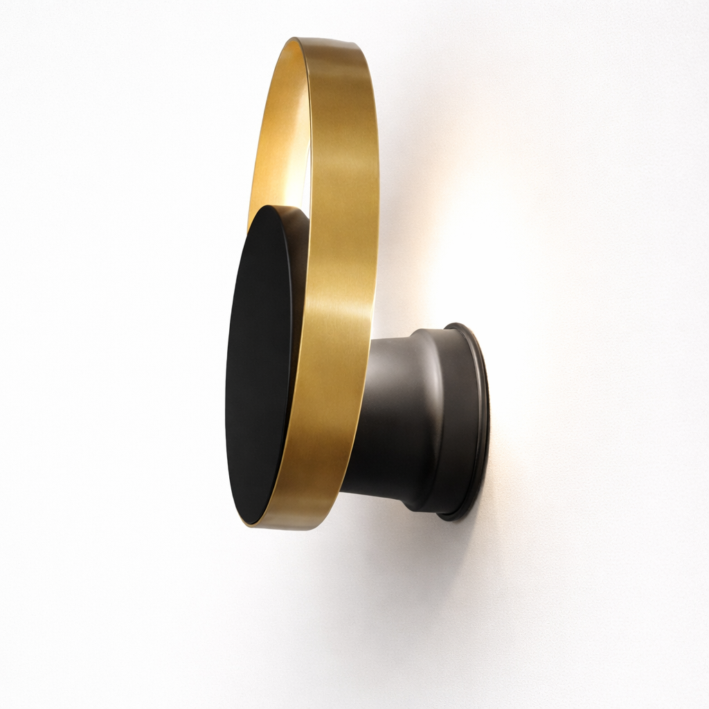 Wall-mounted light fixture with gold and black design on a white background