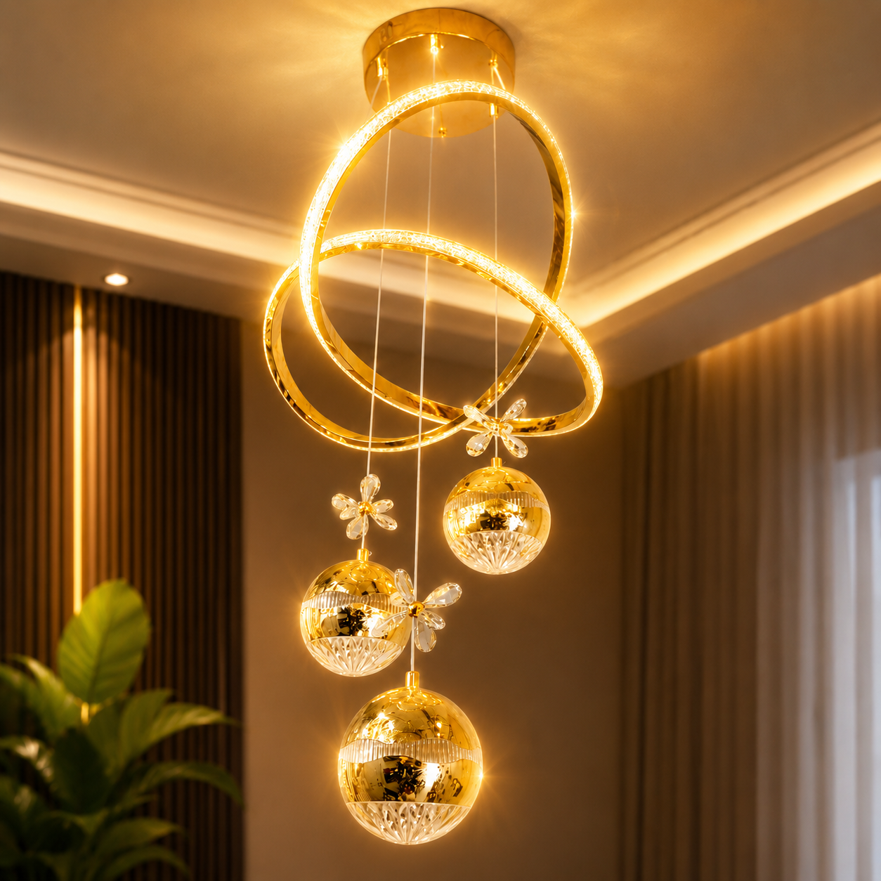 Decorative ceiling light fixture with gold rings and crystal balls in a room setting.