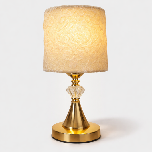 “Gold table lamp with fabric shade for bedroom décor”