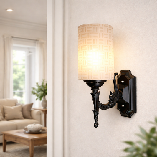 Black decorative wall sconce with cream patterned fabric shade