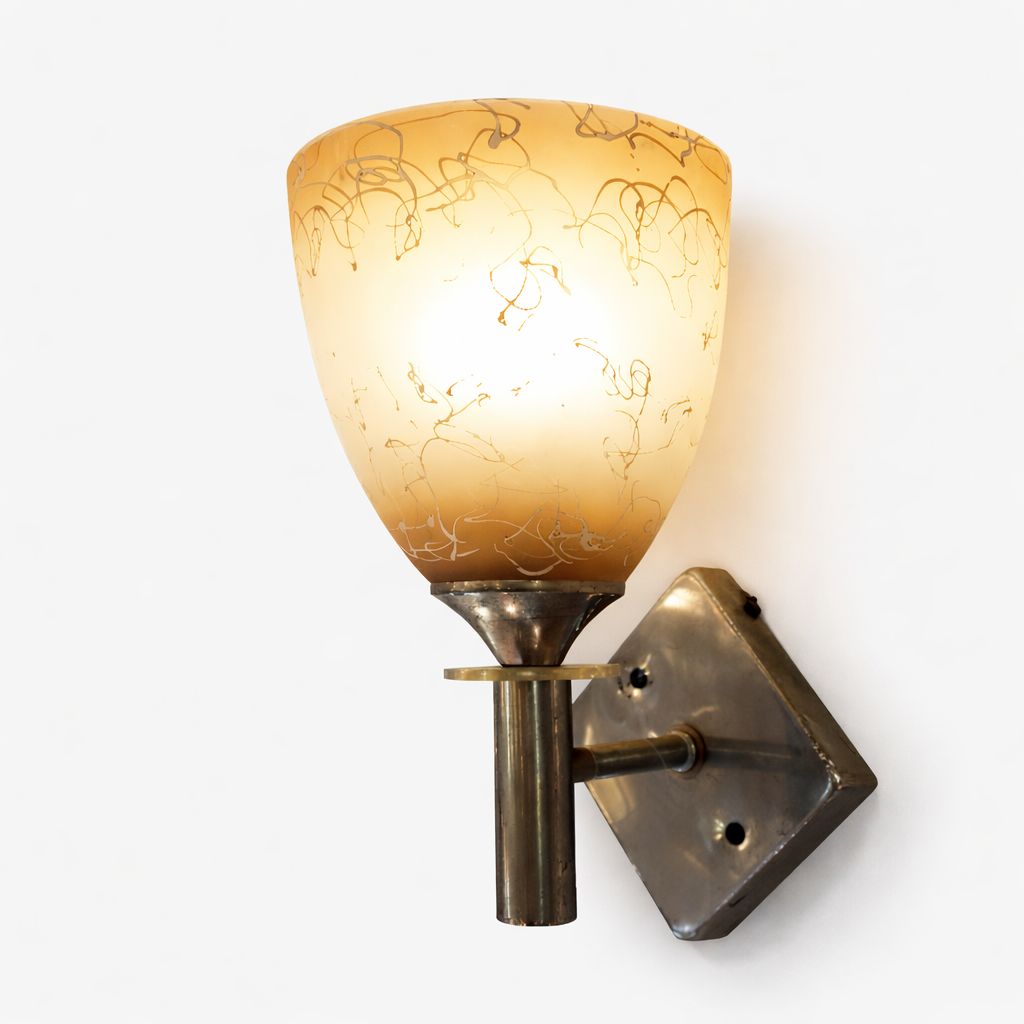 Golden glass wall sconce light with warm ambient glow