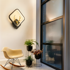Black and gold LED wall sconce for bedroom or hallway lighting”
