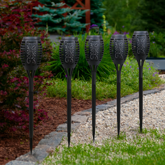 Set of six waterproof solar flame torches for outdoor garden lighting with realistic LED flame design and easy setup