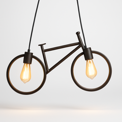 Bicycle-shaped pendant light with two lit bulbs on a plain background