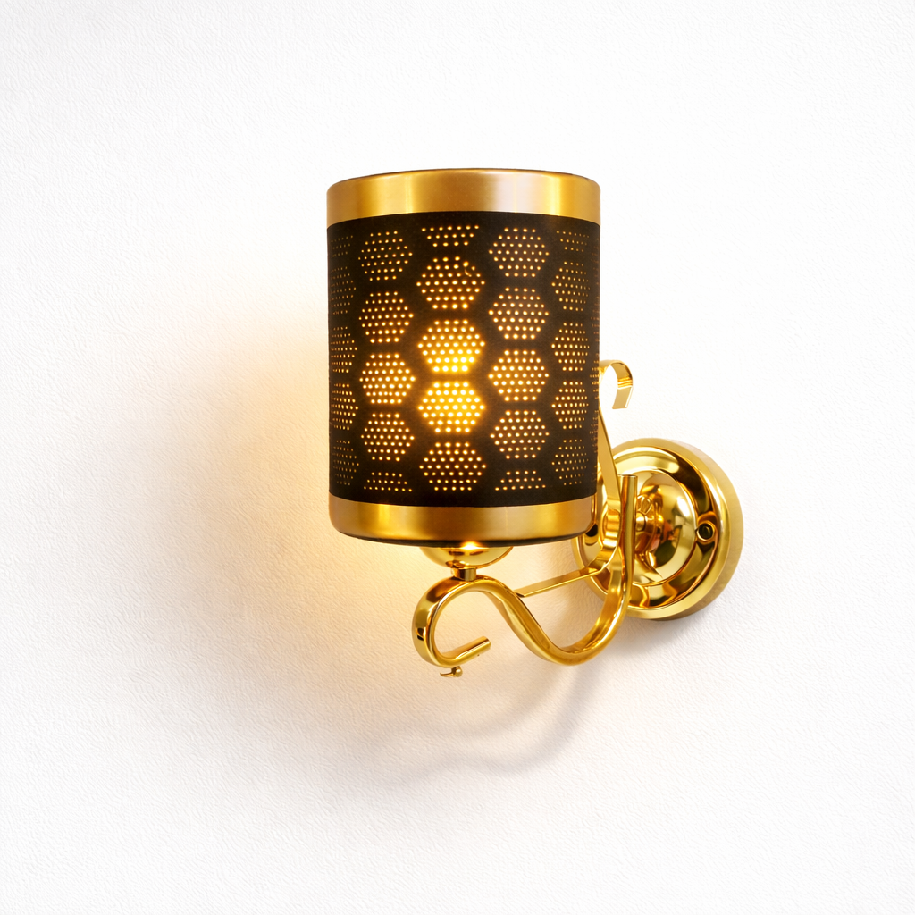 Luxury gold wall sconce with perforated metal shade and warm glow