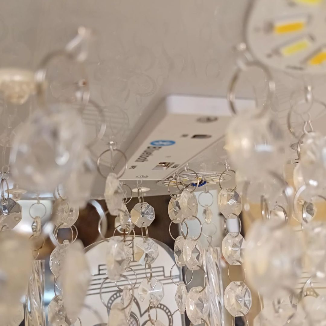 Modern chandelier with floral crystal panels and MP3 Bluetooth sound system