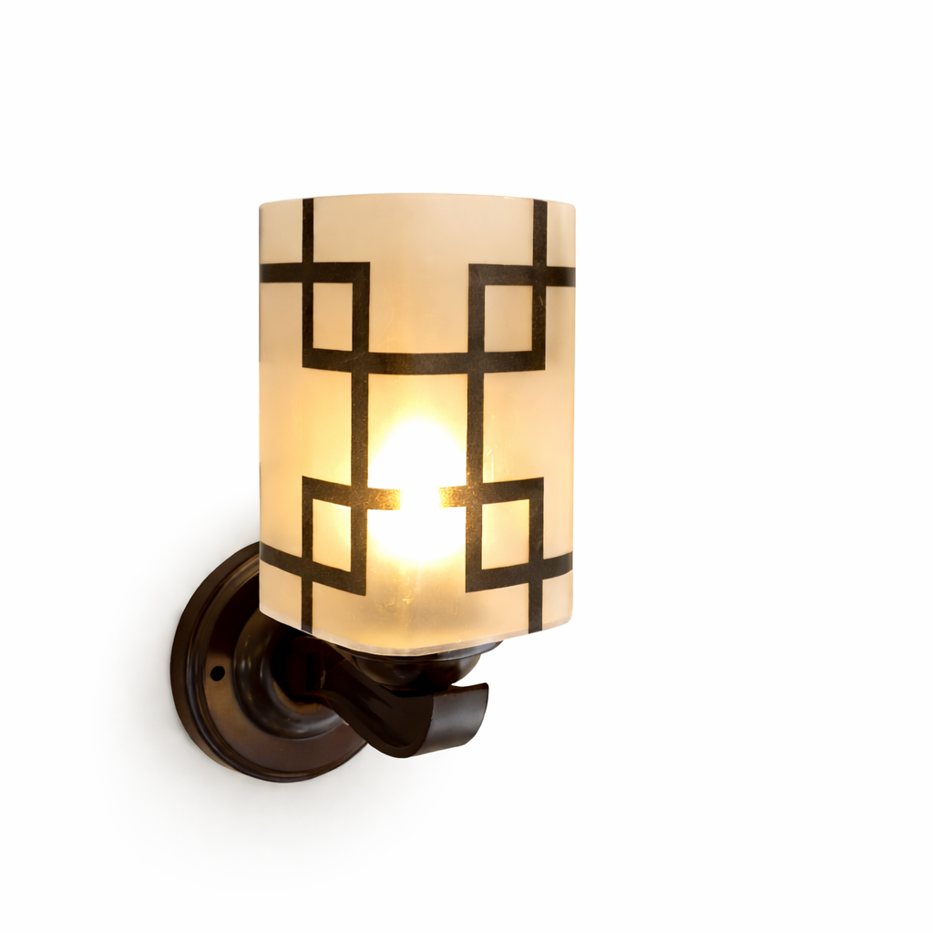 Modern wall sconce light with frosted glass shade glow