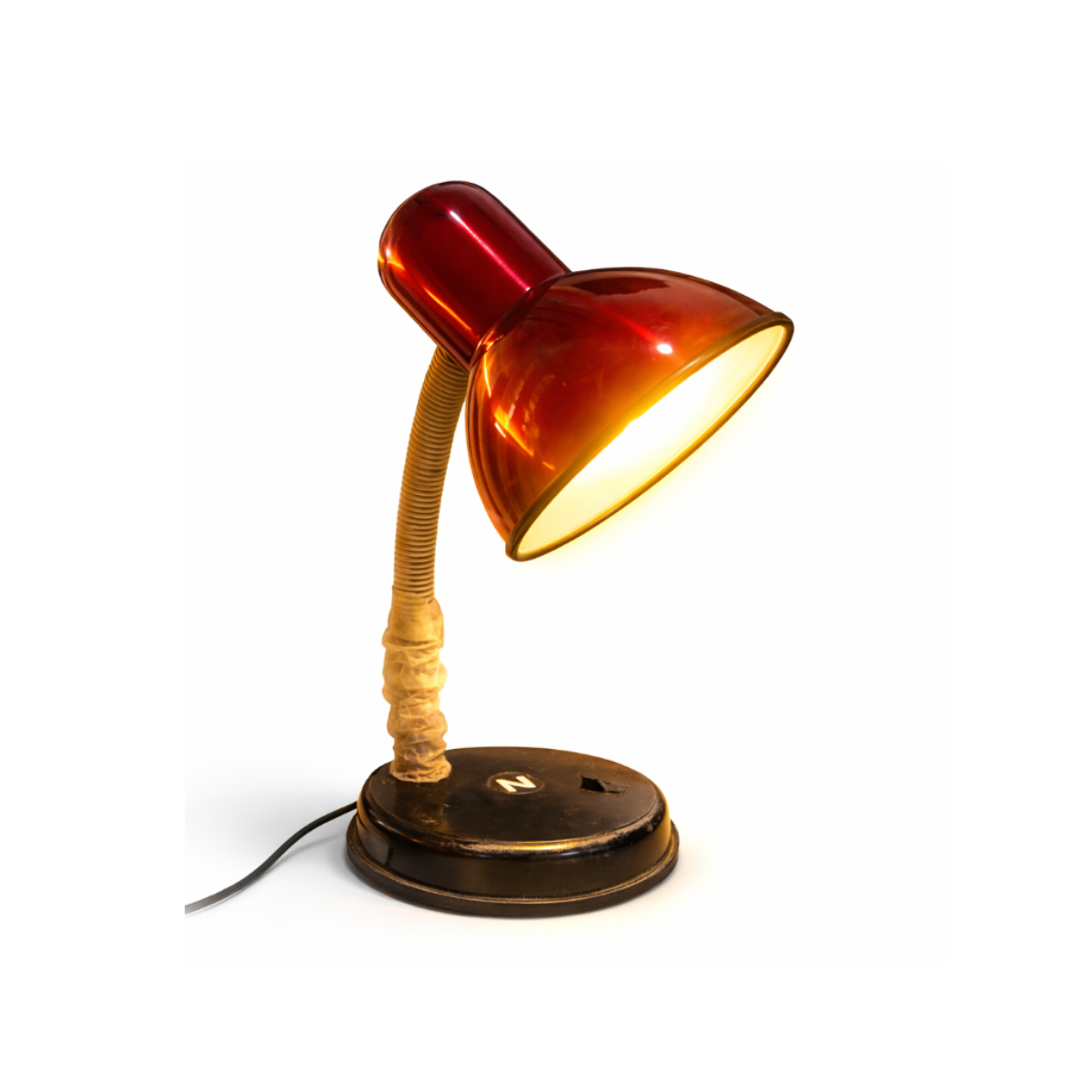 Vintage-style desk lamp with orange glass shade on a white background   