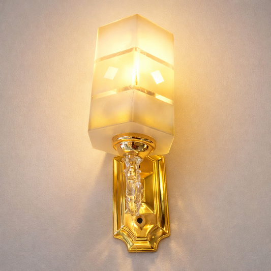 Gold LED wall light with frosted glass for luxury interiors