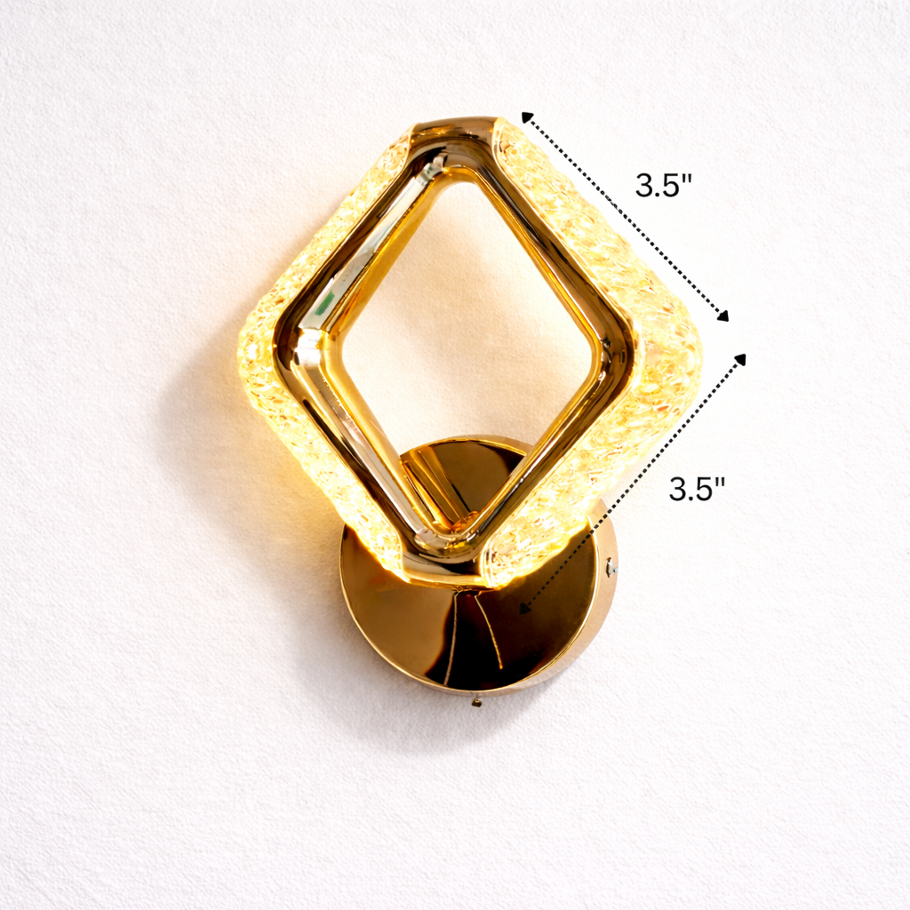 Gold wall sconce with dimensions indicated on a white background