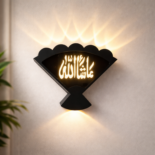 Decorative wall light with illuminated text on a plain wall