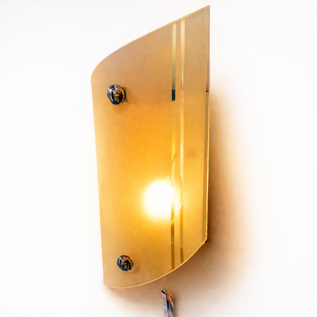 Modern wall light with frosted glass and warm golden glow