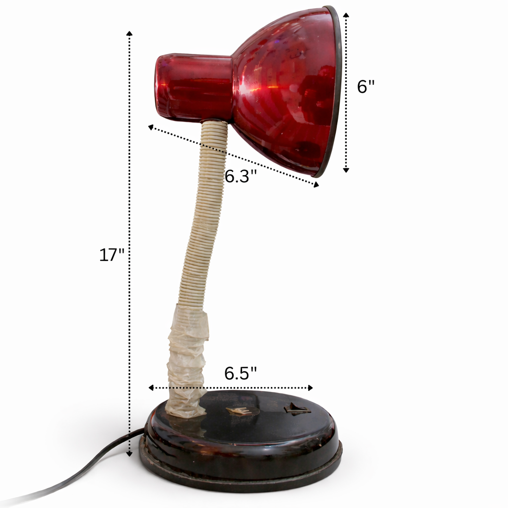 Vintage-style desk lamp with red glass shade and measurements on a white background
