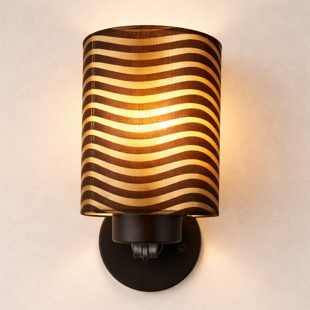 Modern wall sconce light with brown shade and warm glow