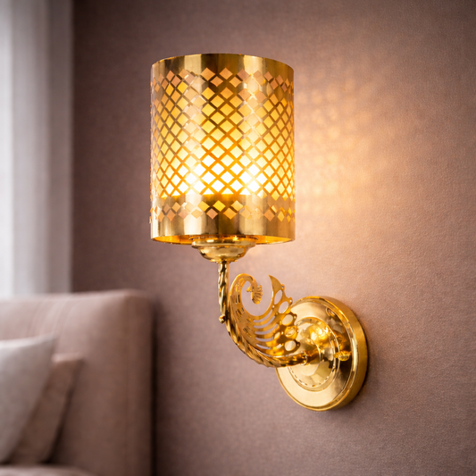 gold wall sconce installed on bedroom wall with warm lighting