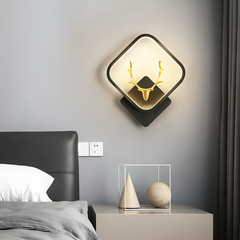 Luxury wall lamp with golden antler design and warm LED glow