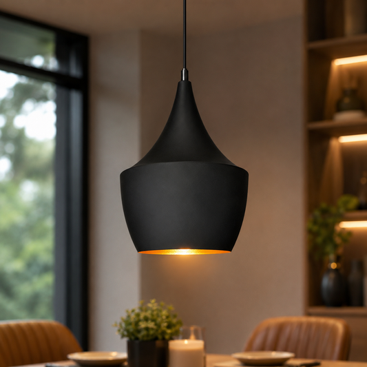 Modern matte black pendant light hanging above dining table