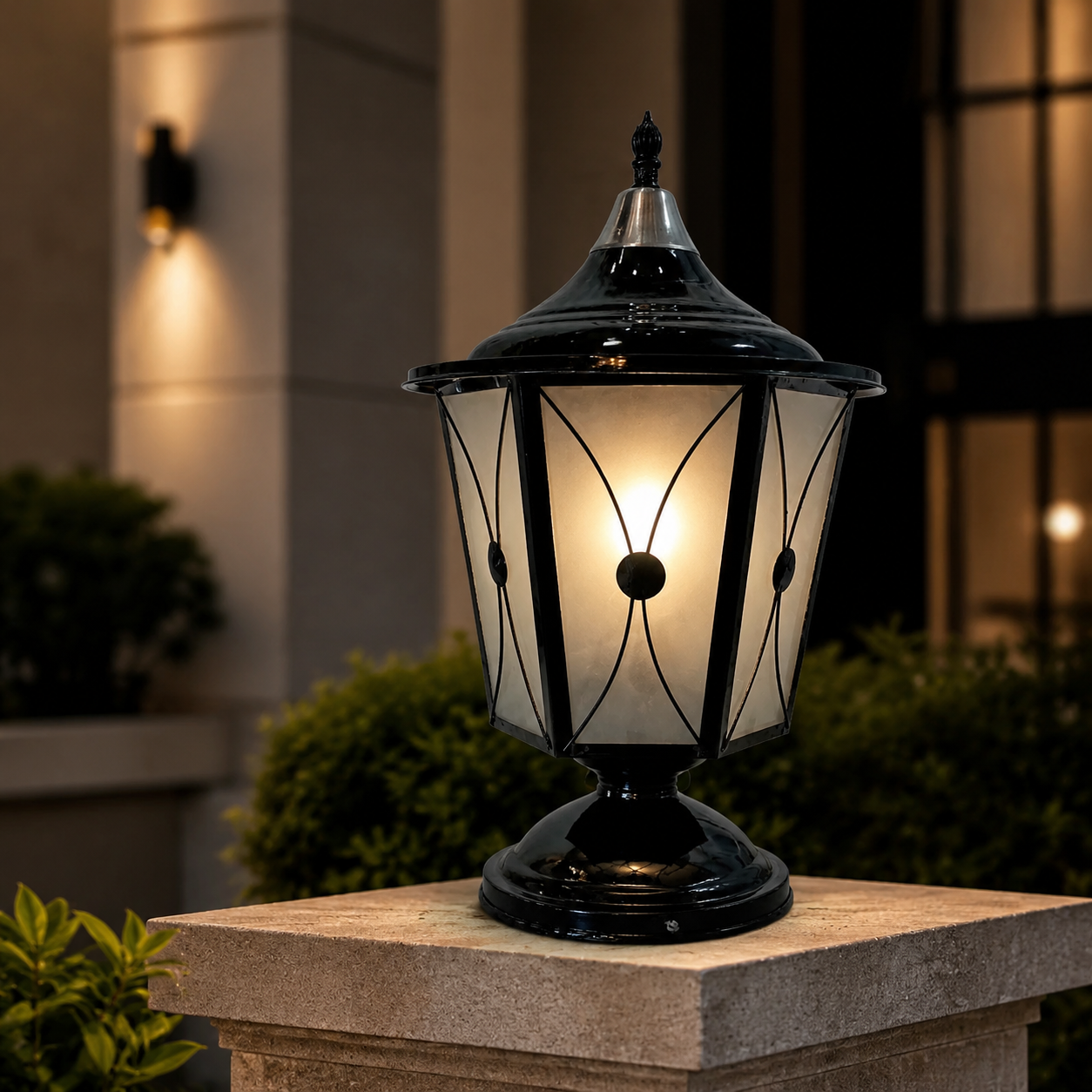 Decorative outdoor lamp on a pedestal with a blurred background