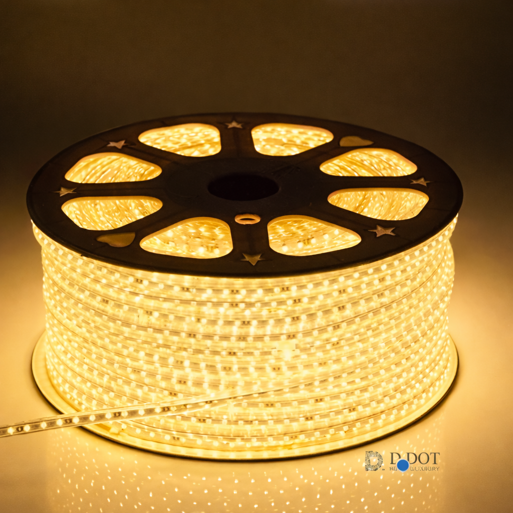 Spool of LED strip light with warm glow on a dark background