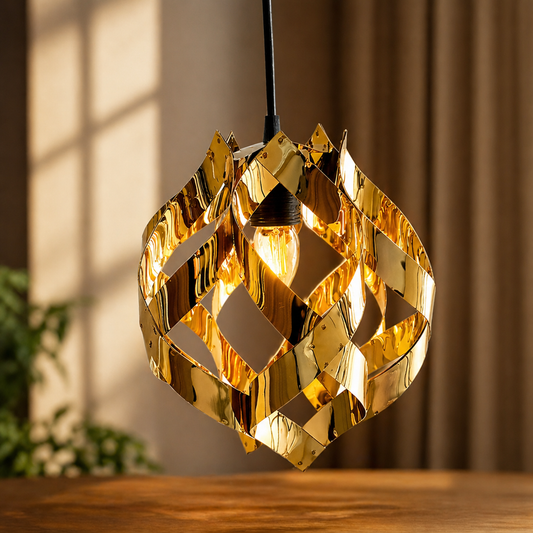 Gold geometric pendant light on a wooden surface with a blurred background