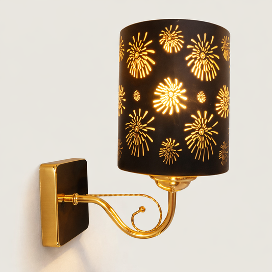 Gold wall sconce with patterned glass shade for interiors