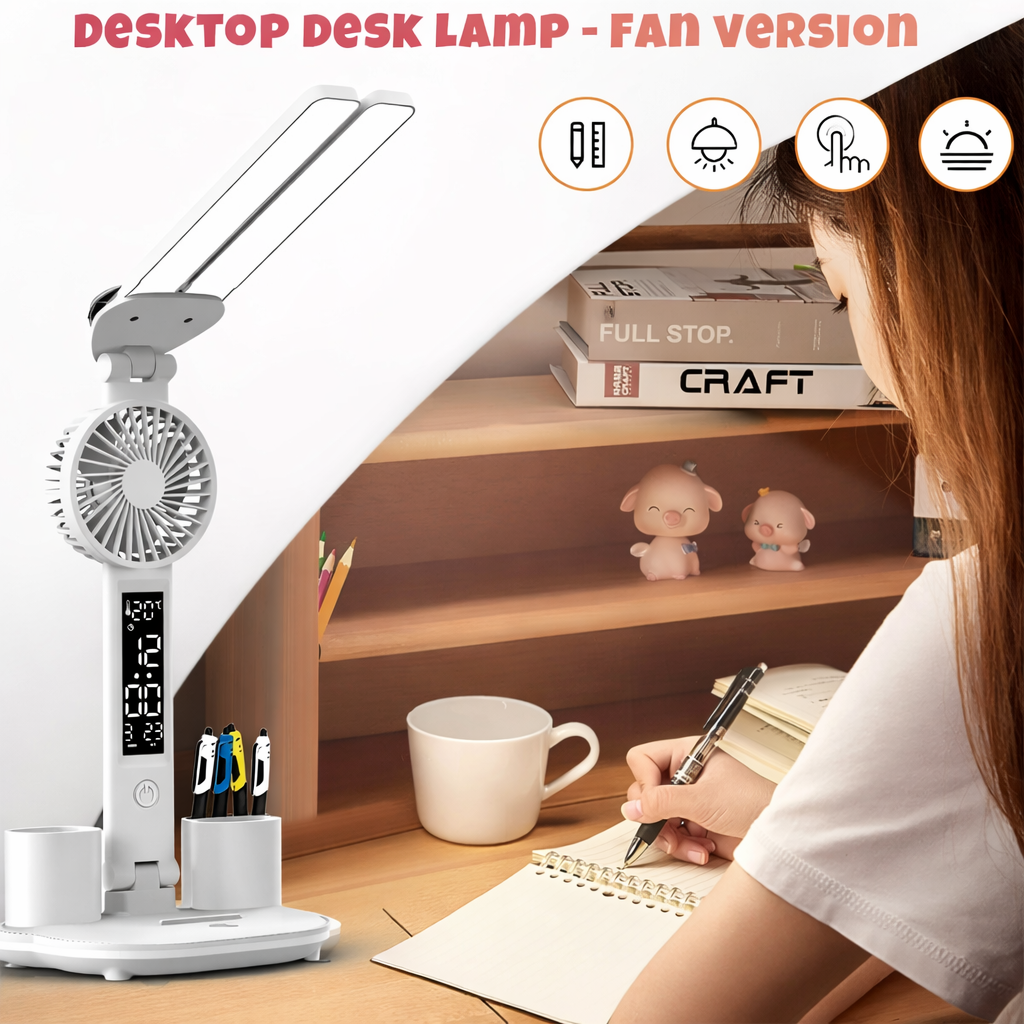 Desktop lamp with fan on a desk next to a person writing, with books and decor in the background.