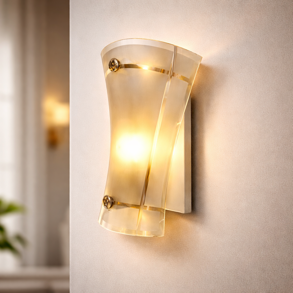 Modern glass wall sconce glowing warmly on textured indoor wall