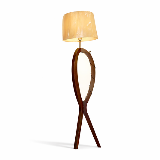 Wooden floor lamp with a beige lampshade on a white background