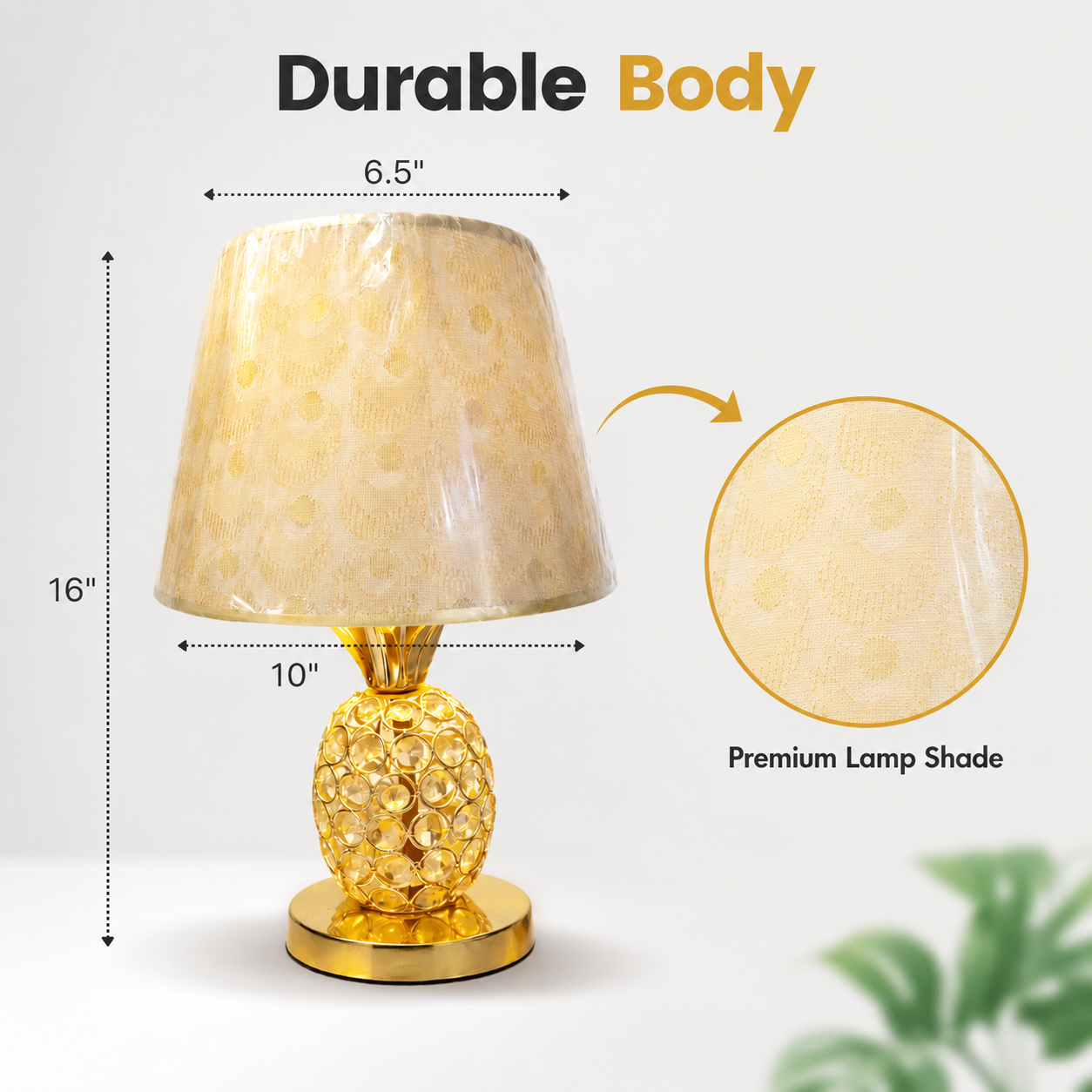 Gold table lamp with measurements and details on a white background