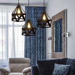   "Modern black geometric pendant light with polygonal metal cage design