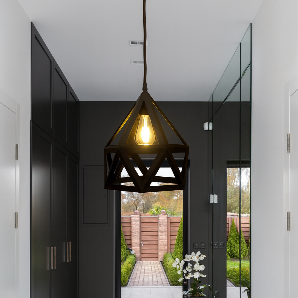 Modern hallway interior featuring a geometric pendant light and glass door.
