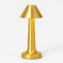 Gold table lamp on a white background