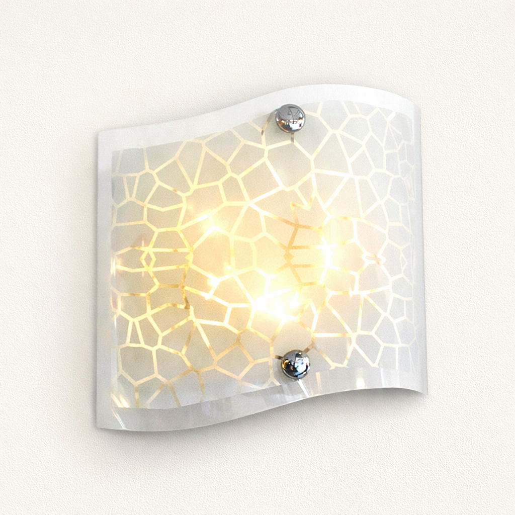Modern glass wall sconce with warm golden glow lighting
