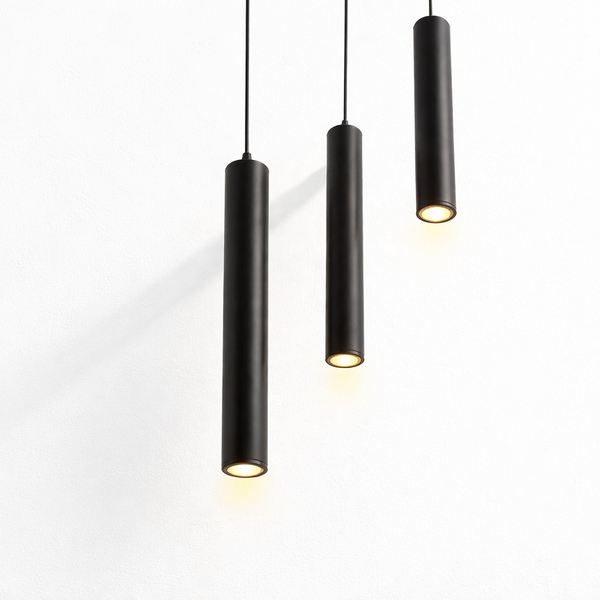 Black cylindrical pendant light with warm LED glow for modern homes