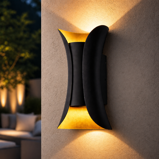 Modern outdoor wall light fixture on a concrete wall with blurred garden background