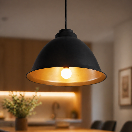 Black pendant light with a warm glow in a blurred indoor setting