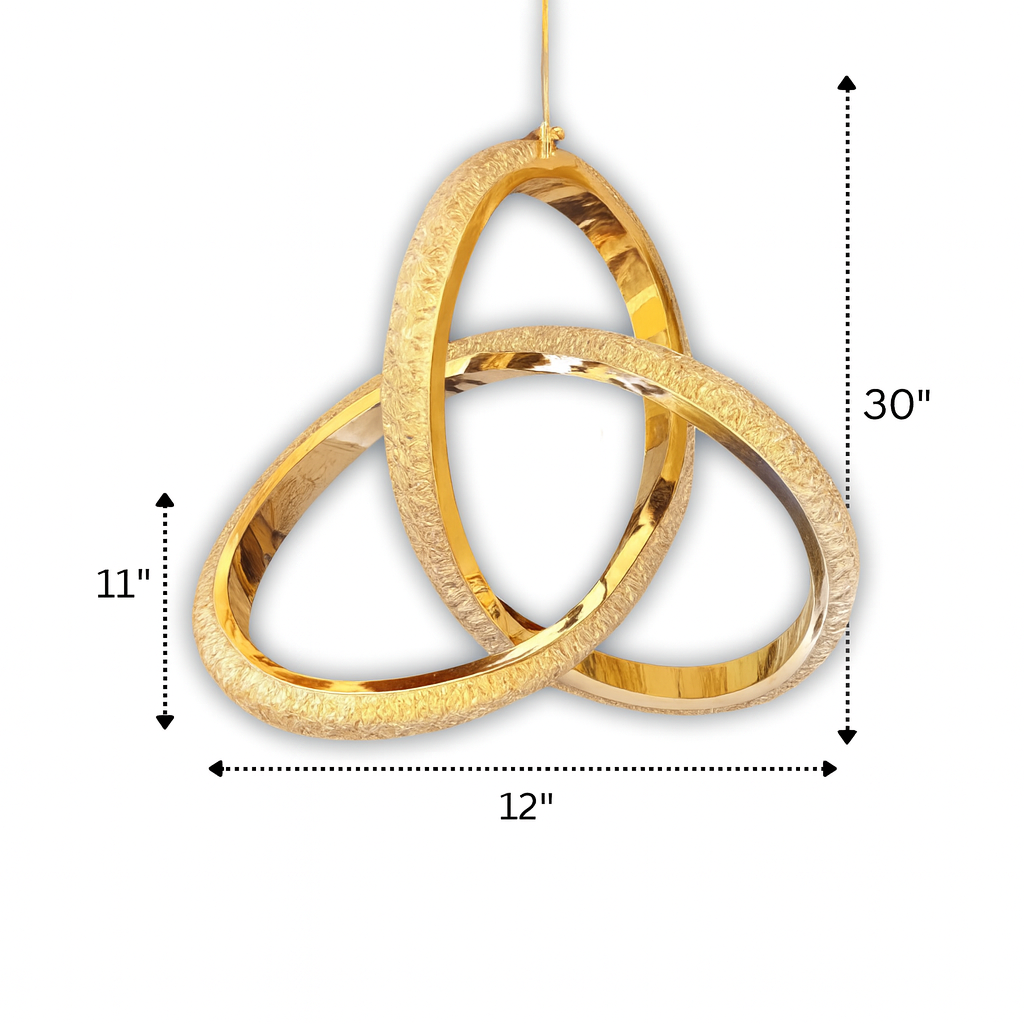 A high-resolution product image of a modern gold chandelier featuring three interlocking textured rings with polished interiors. The chandelier is shown against a clean white background with soft natural shadows and labeled dimensions of 12 inches wide and 11 inches tall, emphasizing its elegant design and craftsmanship.